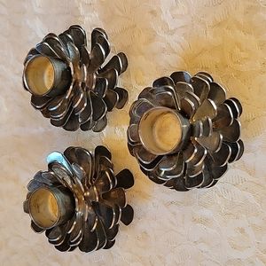 Set of three vintage silver plated pinecone taper candle holders.